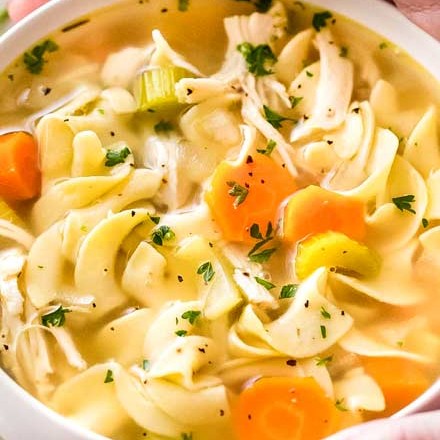 Guaranteed to warm you from the inside out, this homemade chicken noodle soup is made in the crockpot for an ultra-easy home-cooked meal that will feed your soul! #chickennoodlesoup #crockpotrecipe #slowcookermeal #chickennoodle #souprecipe #chickensoup