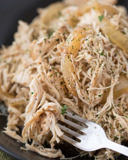 Easy all-purpose shredded chicken made in the crockpot with spices and beer.  Make a big batch and use it to make different meals all week long! | #chicken #shreddedchicken #pulledchicken #beer #braised #allpurpose #multipurpose #slowcooker #crockpot