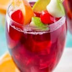 This copycat recipe of Applebee's popular red apple sangria is crazy spot on, and is super easy to make! Easy to adjust to make for a crowd! #copycatrecipe #sangria #redapplesangria #redsangria #applebeesrecipes #drinkrecipe