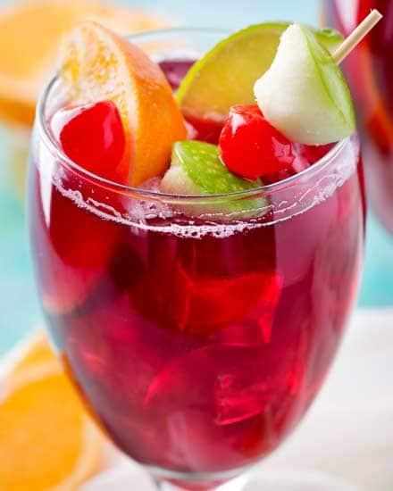 This copycat recipe of Applebee's popular red apple sangria is crazy spot on, and is super easy to make! Easy to adjust to make for a crowd! #copycatrecipe #sangria #redapplesangria #redsangria #applebeesrecipes #drinkrecipe
