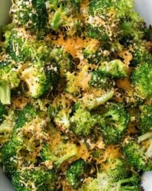 Simple ingredients and an easy 5 minutes of prep is all it takes to get this mouthwatering roasted broccoli in the oven! You'll love the cheesy topping, and even non-veggie lovers will go crazy over this healthy side dish!! #broccoli #roastedbroccoli #weightwatchers #freestyle #smartpoints