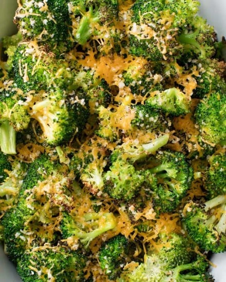 Simple ingredients and an easy 5 minutes of prep is all it takes to get this mouthwatering roasted broccoli in the oven!  You'll love the cheesy topping, and even non-veggie lovers will go crazy over this healthy side dish!! #broccoli #roastedbroccoli #weightwatchers #freestyle #smartpoints