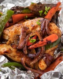 Chicken Fajita Foil Packs are the perfect easy meal for summer cookouts or a camping trip! Loaded with smoky flavors and classic chicken fajita ingredients, this low carb meal is tasty and fun to make! #chickenfajitas #fajitas #foilpack #hobopack #foilpackets #grilling #chickenrecipe #lowcarb #keto
