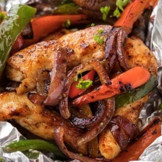 Chicken Fajita Foil Packs are the perfect easy meal for summer cookouts or a camping trip! Loaded with smoky flavors and classic chicken fajita ingredients, this low carb meal is tasty and fun to make! #chickenfajitas #fajitas #foilpack #hobopack #foilpackets #grilling #chickenrecipe #lowcarb #keto