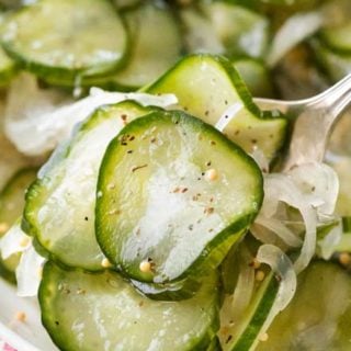 Sweet and tangy with PLENTY of crunch, these freezer pickles perfect year-round! No complicated canning steps or equipment needed! #pickles #homemade #freezerpickles #cucumbers #farmersmarket #gardenfresh #howto