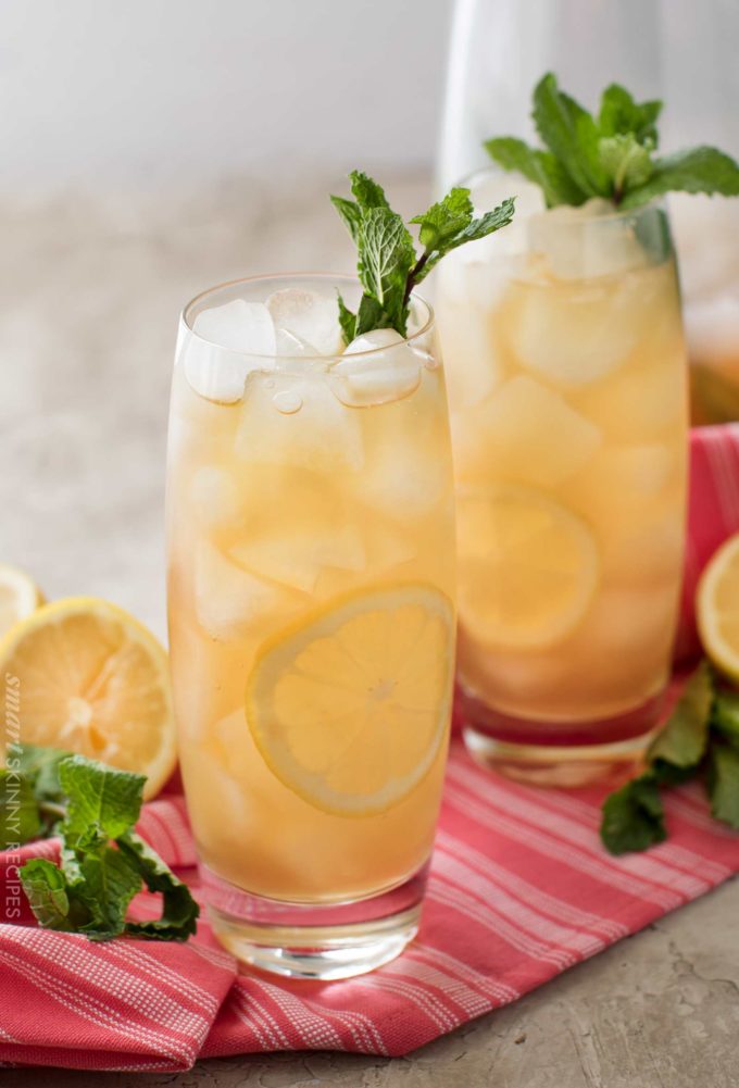 Two glasses of green tea with lemon and mint