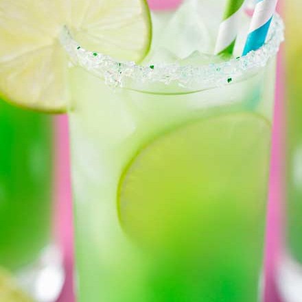 Tropical, sweet, and beautifully colored, this is one rum punch you have to try! #rum #rumpunch #punch #summer #drink #cocktail #mermaid