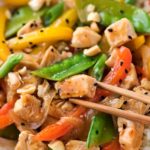 This Szechuan-style Chicken Stir Fry is the quickest and easiest weeknight meal!  Bold flavors, nutritious ingredients, and ready in just 20 minutes! #chicken #stirfry #asianrecipe #weeknightmeal #easydinner #szechuan #smartpoints #weightwatchers