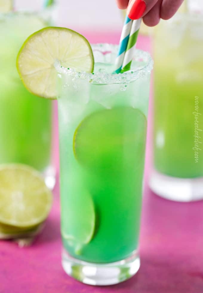 Blue green color of mermaid rum punch cocktail