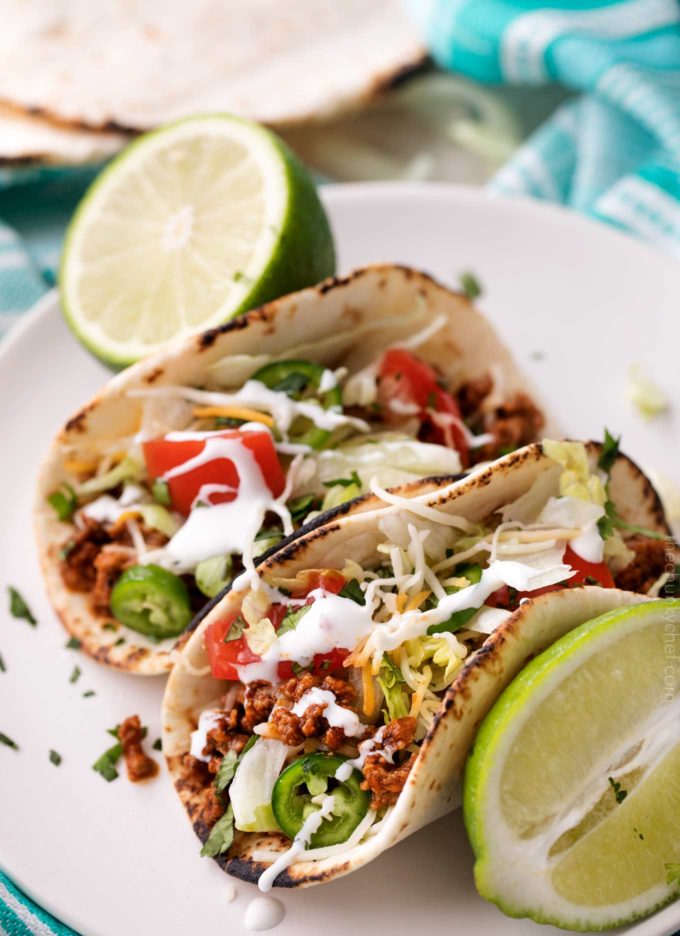 Slow cooker beef tacos on white plate