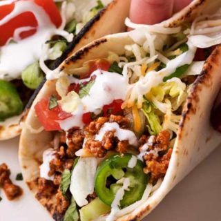 Have dinner ready to go when you come home with these crockpot beef tacos! The taco meat is slow simmered and incredibly tender and juicy! #tacos #tacotuesday #taconight #beeftacos #slowcooker #crockpot #weeknightdinner #instantpot #pressurecooker
