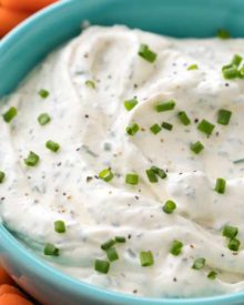 Perfect for football parties or any gathering, this creamy vegetable dip is full of garlic and herb flavors! Plain ranch can't hold a candle to this easy veggie dip! #dip #diprecipe #vegetables #veggiedip #partyfood #snacks