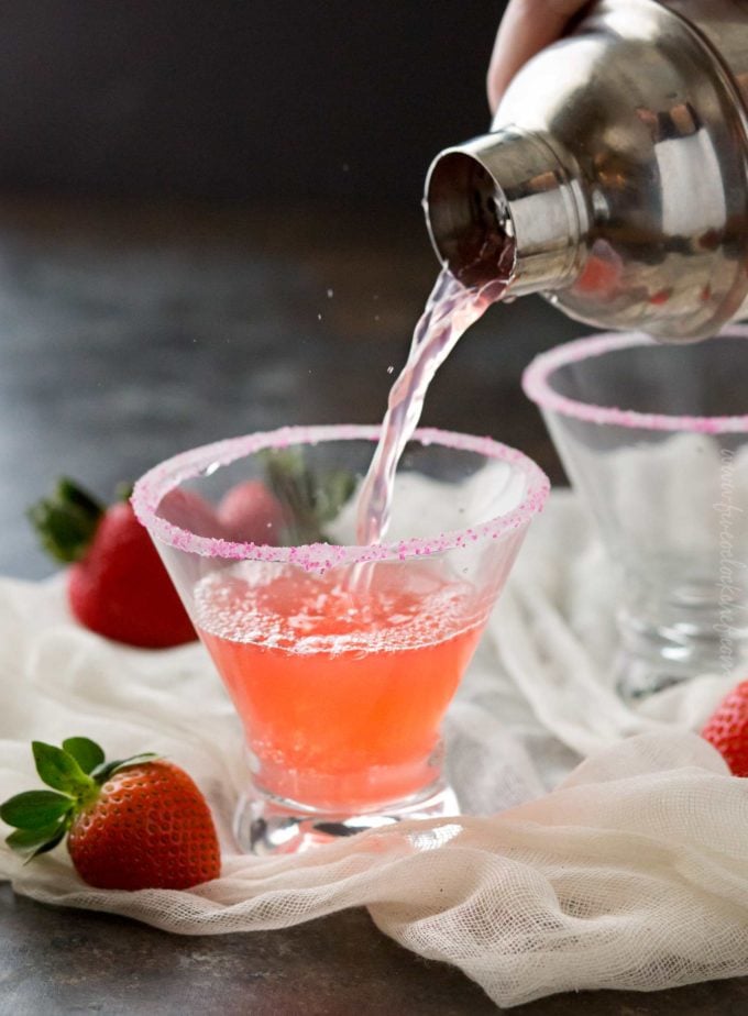 Pouring vodka cocktail into serving glass