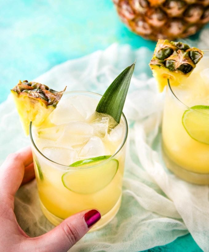 This tropical pineapple coconut rum punch is sweet and a perfect drink for a party!  Drinking this cocktail will make you feel like you're at the beach! #drinks #cocktail #pineapple #coconut #rum #tropical #party
