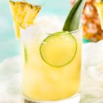 This tropical pineapple coconut rum punch is sweet and a perfect drink for a party!  Drinking this cocktail will make you feel like you're at the beach! #drinks #cocktail #pineapple #coconut #rum #tropical #party