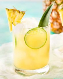 This tropical pineapple coconut rum punch is sweet and a perfect drink for a party! Drinking this cocktail will make you feel like you're at the beach! #drinks #cocktail #pineapple #coconut #rum #tropical #party