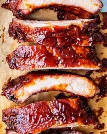 Delicious homemade smoked ribs are easier to make than you think, especially using the popular 3-2-1 method. Fall of the bone tender, and lip-smackingly good, these ribs are FABULOUS!! #ribs #pork #bbq #smoked #smoking #grilling #easyrecipe