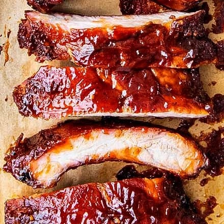 Delicious homemade smoked ribs are easier to make than you think, especially using the popular 3-2-1 method.  Fall of the bone tender, and lip-smackingly good, these ribs are FABULOUS!! #ribs #pork #bbq #smoked #smoking #grilling #easyrecipe