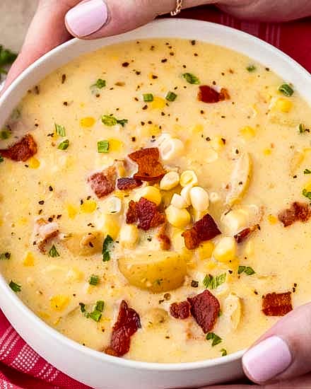 Cozy corn chowder, made with tender potatoes, salty bacon and sweet corn!  Perfect as a weeknight meal!  Crockpot directions too! #soup #chowder #cornchowder #fall #souprecipe #weeknightmeal #crockpot #slowcooker