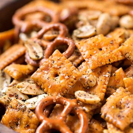 Baked to buttery perfection, this Italian herb snack mix is the perfect after school or party snack. No need to eat bagged snacks, homemade is really easy! #snackmix #snacks, #partyfood #chexmix #italianherb