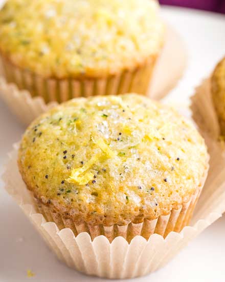 Bakery-style lemon poppy seed muffins with grated zucchini that have the most amazingly soft and fluffy texture, and are complete with a crunchy sugary crust on top! #muffins #lemon #poppyseed #zucchini #bakerystyle #easyrecipe #brunch #breakfast
