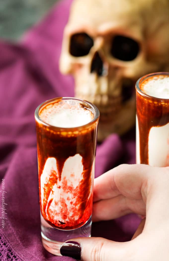 Gory and delicious, these vanilla milkshake shots take just 5 ingredients to make, and are perfect for a Halloween party! #shots #milkshake #halloween #party #fall #boozy #drink 