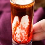 Gory and delicious, these vanilla milkshake shots take just 5 ingredients to make, and are perfect for a Halloween party! #shots #milkshake #halloween #party #fall #boozy #drink 