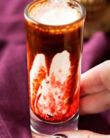 Gory and delicious, these vanilla milkshake shots take just 5 ingredients to make, and are perfect for a Halloween party! #shots #milkshake #halloween #party #fall #boozy #drink