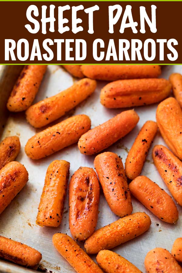 These simple roasted carrots are made easily on a sheet pan, with a simple roasting method that brings out the natural sweetness of the baby carrots.  They're the perfect side dish!  #roasted #carrots #sidedish #holidayrecipe #carrotrecipe #sheetpan #healthy #side #thanksgiving