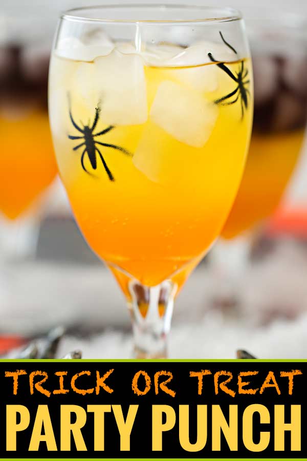 This non-alcoholic Halloween party punch is layered to resemble candy corn, with plastic spiders added for a fun spooky effect! #punch #party #trickortreat #halloween #nonalcoholic #drinkrecipe #mocktail