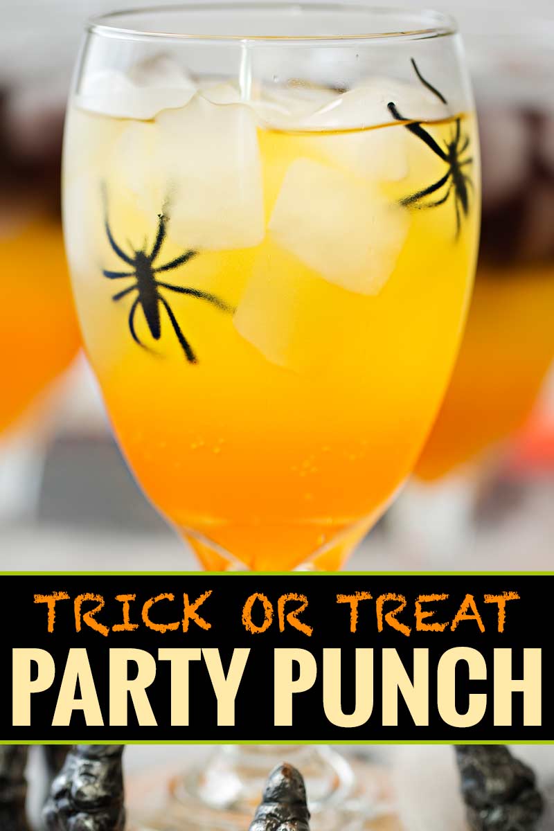 This non-alcoholic Halloween party punch is layered to resemble candy corn, with plastic spiders added for a fun spooky effect! #punch #party #trickortreat #halloween #nonalcoholic #drinkrecipe #mocktail