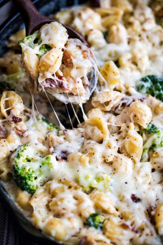 Serving spoonful of cheesy chicken and broccoli casserole