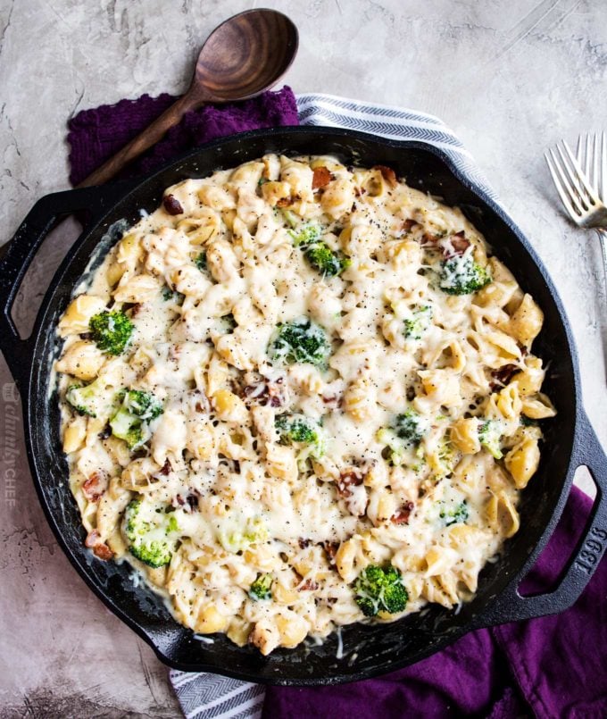 Overhead view of cast iron skillet full of cheesy chicken casserole