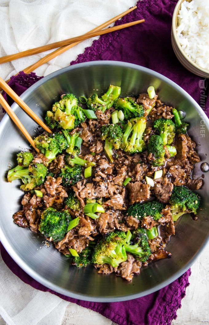 Beef and broccoli in skillet with chopsticks