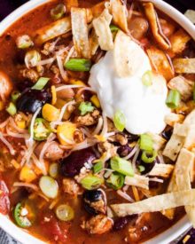 Packed with flavor, this Crockpot Taco Soup tastes just like your favorite taco, in comforting soup form! Perfect for a hectic weeknight dinner, there are slow cooker, stovetop and instant pot directions! #taco #soup #crockpot #slowcooker #weeknight #easyrecipe #comfortfood