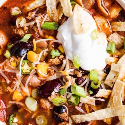 Packed with flavor, this Crockpot Taco Soup tastes just like your favorite taco, in comforting soup form!  Perfect for a hectic weeknight dinner, there are slow cooker, stovetop and instant pot directions! #taco #soup #crockpot #slowcooker #weeknight #easyrecipe #comfortfood