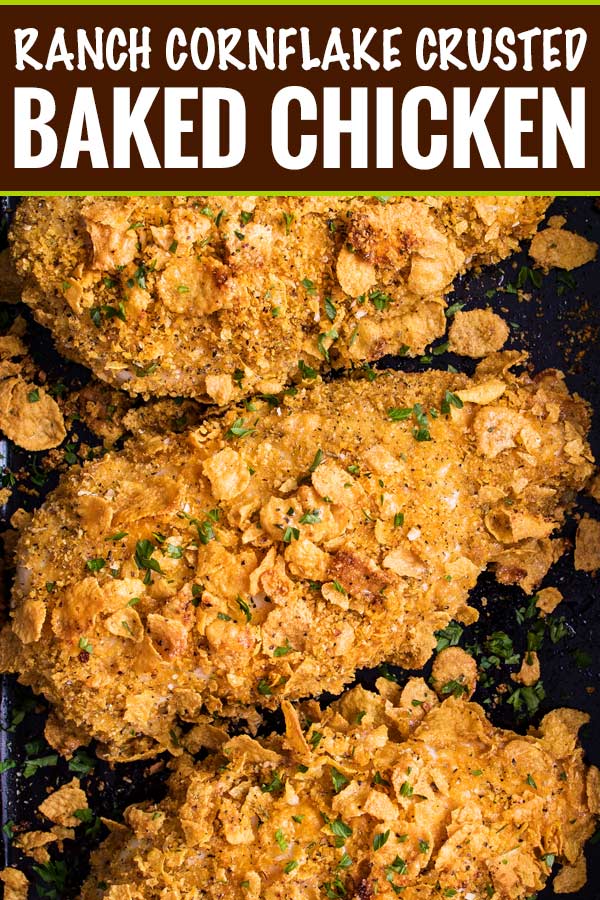 Crunchy, juicy baked chicken made by slathering chicken breasts in ranch dressing then coating in seasoned cornflakes.  All the satisfying crunch of fried chicken, but with less fat and more flavor! #chicken #cornflake #baked #easyrecipe 