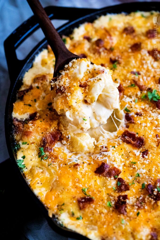 Spoonful of baked mac and cheese in skillet