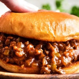 Perfect for quick dinner, these family-favorite homemade sloppy joes are ready in 30 minutes or less! The silky rich sauce is ultra flavorful with a zesty kick! #sloppyjoes #weeknight
