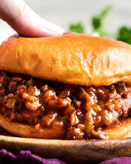 Perfect for quick dinner, these family-favorite homemade sloppy joes are ready in 30 minutes or less!  The silky rich sauce is ultra flavorful with a zesty kick! #sloppyjoes #weeknight