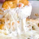 Creamy, cheesy and garlicky, this baked shrimp dip tastes like a dip-able version of shrimp scampi! #shrimp #dip #scampi #appetizer #partyfood #gameday #cheesy #easyrecipe #partyrecipe