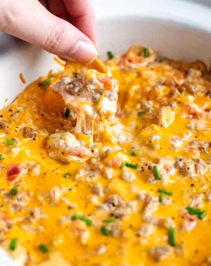 Cheesy creamy sausage rotel dip in slow cooker