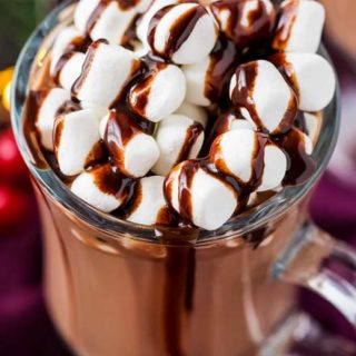 Make creamy hot chocolate for the whole party, right in your slow cooker! This hot chocolate is made with plenty of nutella for a creamy hazelnut drink that's absolutely amazing! #hotchocolate #crockpothotchocolate #hotchocolaterecipes #nutella #holidaydrinks #hotcocoa #cocoa #chocolate #drink
