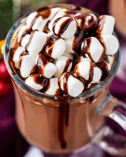 Make creamy hot chocolate for the whole party, right in your slow cooker! This hot chocolate is made with plenty of nutella for a creamy hazelnut drink that's absolutely amazing! #hotchocolate #crockpothotchocolate #hotchocolaterecipes #nutella #holidaydrinks #hotcocoa #cocoa #chocolate #drink