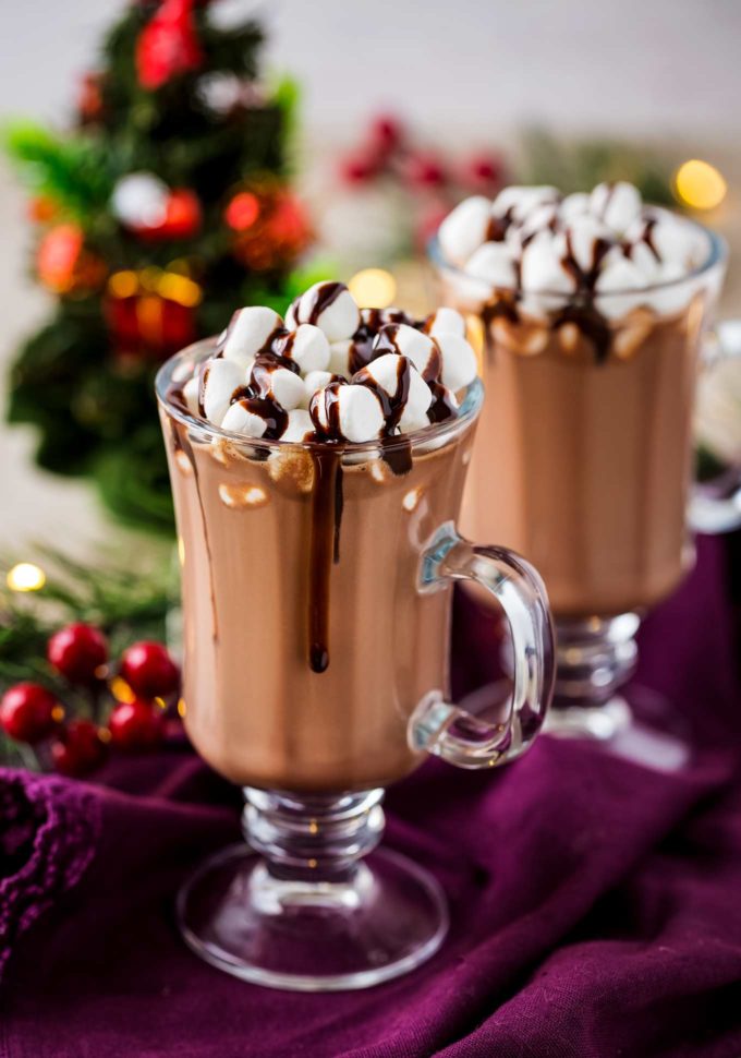 Make creamy hot chocolate for the whole party, right in your slow cooker! This hot chocolate is made with plenty of nutella for a creamy hazelnut drink that's absolutely amazing! #hotchocolate #crockpothotchocolate #hotchocolaterecipes #nutella #holidaydrinks #hotcocoa #cocoa #chocolate #drink