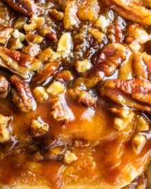 Deliciously tender, sweet and sticky, these sticky buns are made with a homemade maple-caramel sauce that is out of this world! #stickybuns #sweetrolls #cinnamonbun #pecan #caramel #holiday #breakfast #dessert