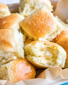 These easy, foolproof homemade dinner rolls served with whipped honey butter are perfect for your Thanksgiving or holiday dinners! With a make-ahead option, you'll be amazed at how easy it is to make bakery-quality rolls in your own kitchen! #dinnerrolls #rolls #thanksgiving #bread #homemaderecipe #yeast #honeybutter