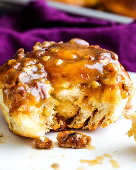 Deliciously tender, sweet and sticky, these sticky buns are made with a homemade maple-caramel sauce that is out of this world! #stickybuns #sweetrolls #cinnamonbun #pecan #caramel #holiday #breakfast #dessert
