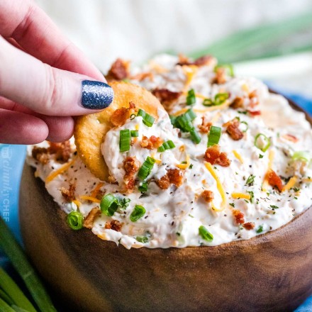 Serving bacon cheese dip with cracker