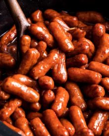 Always a crowd-pleaser, these Crockpot Little Smokies are slow cooked in a sauce made with beer, garlic, honey, brown sugar and bbq sauce. Perfect for game day, holidays, or any party! #littlesmokies #lilsmokies #partyfood #appetizer #recipe #easyrecipe #crockpot #slowcooker